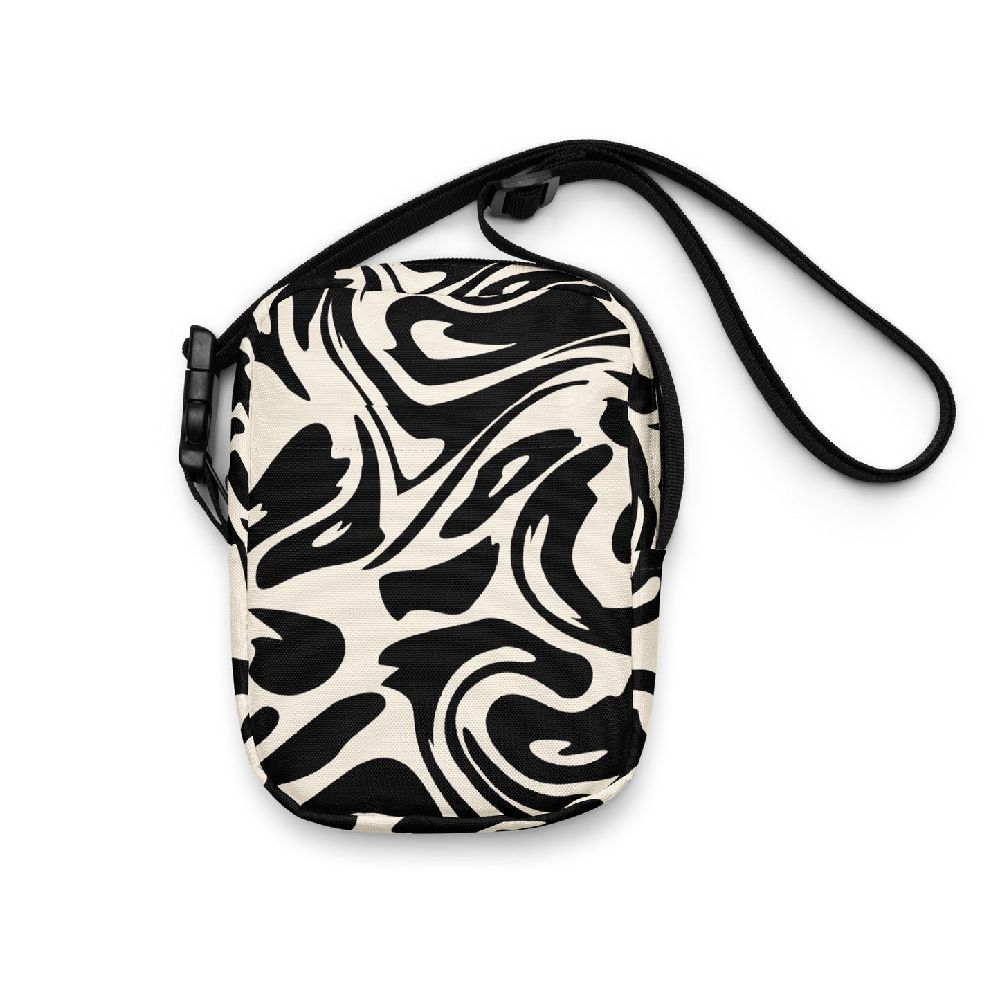 Adjustable utility crossbody bag with two pockets in fluid black and white print