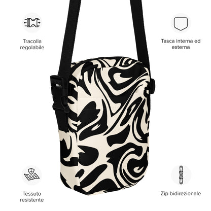 Adjustable utility crossbody bag with two pockets in fluid black and white print